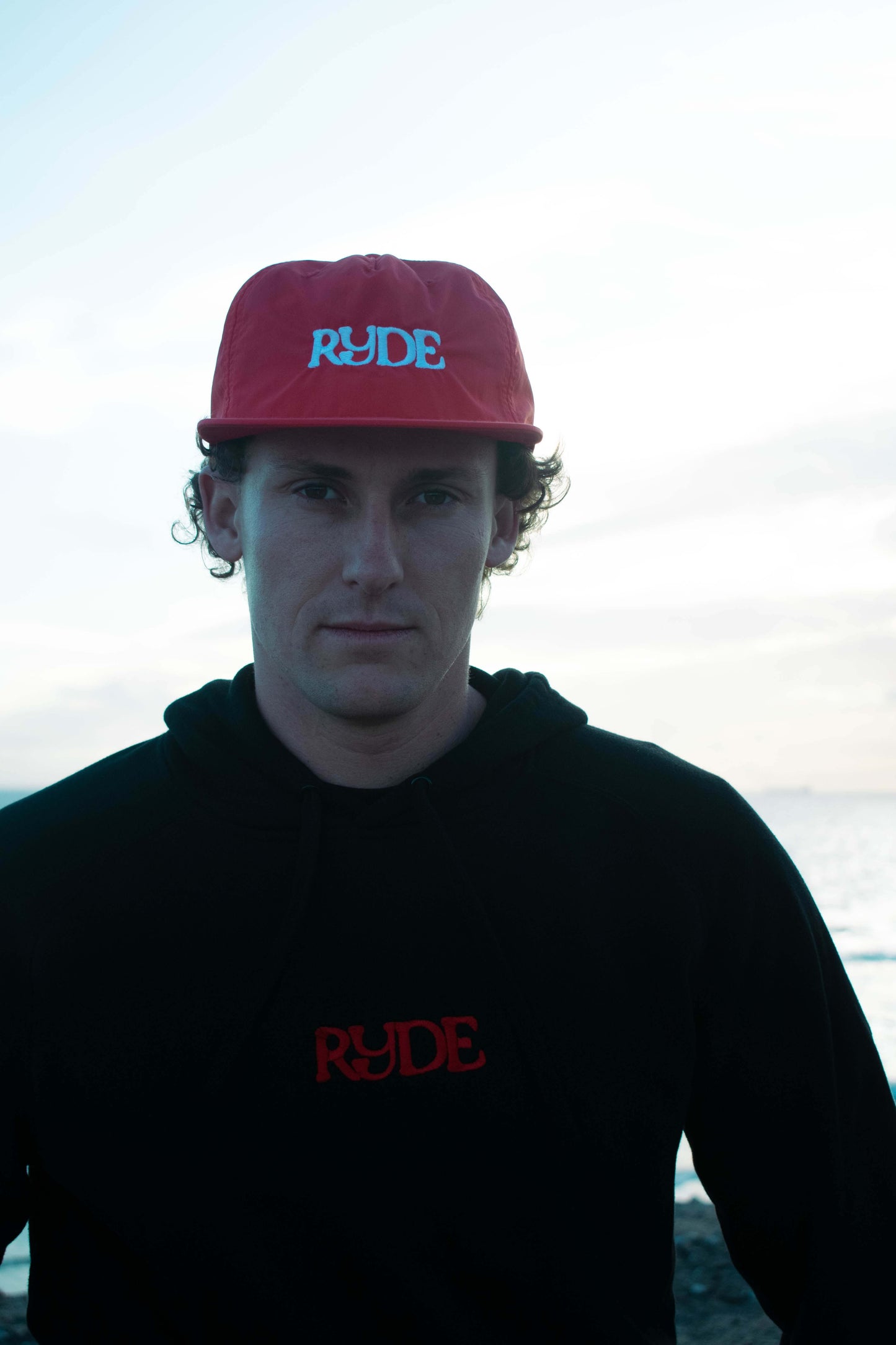 black hoodie embroidered with red logo, ride worldwide, ryde worldwide, ryde worldwyde. Red surf hat beach california